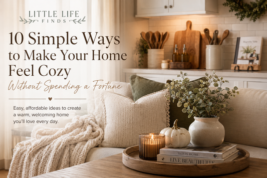 Cozy neutral living room and kitchen with soft blankets, decorative pillows, candles, wood accents, and seasonal décor featured in a Little Life Finds home decorating blog.