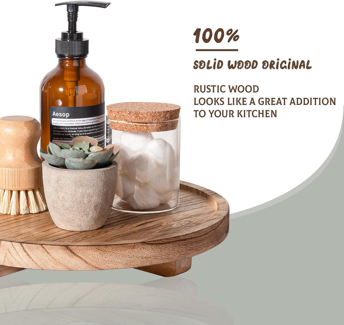 Wooden tray with Aesop bottle, glass jar, and potted plant on a white background